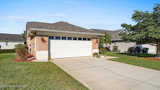 ranch-style home with concrete driveway, roof with shingles, an attached garage, a front lawn, and stucco siding