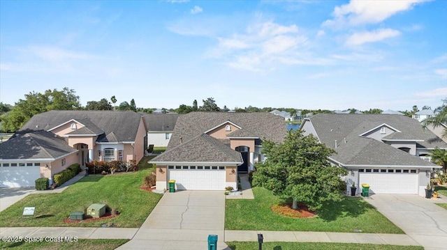 traditional home with a garage, a residential view, a front lawn, and concrete driveway