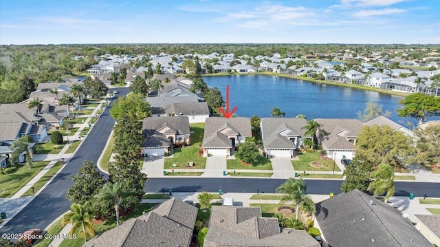 aerial view with a water view and a residential view