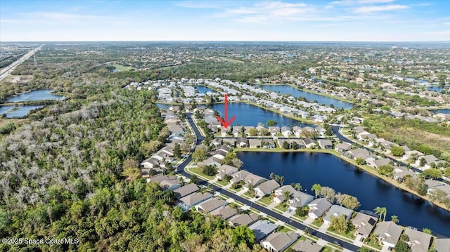 birds eye view of property with a water view and a residential view