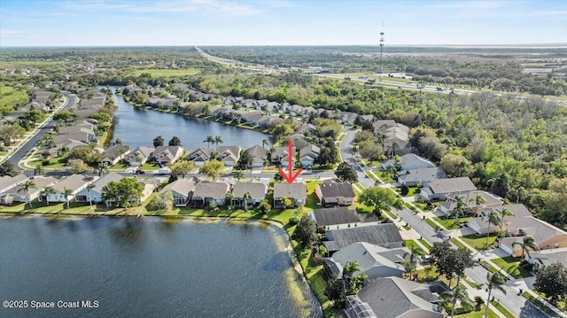 bird's eye view featuring a residential view and a water view