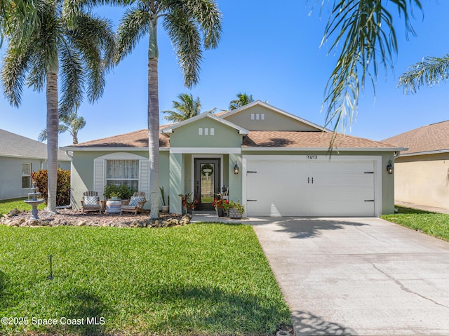 ranch-style home with stucco siding, an attached garage, concrete driveway, and a front yard