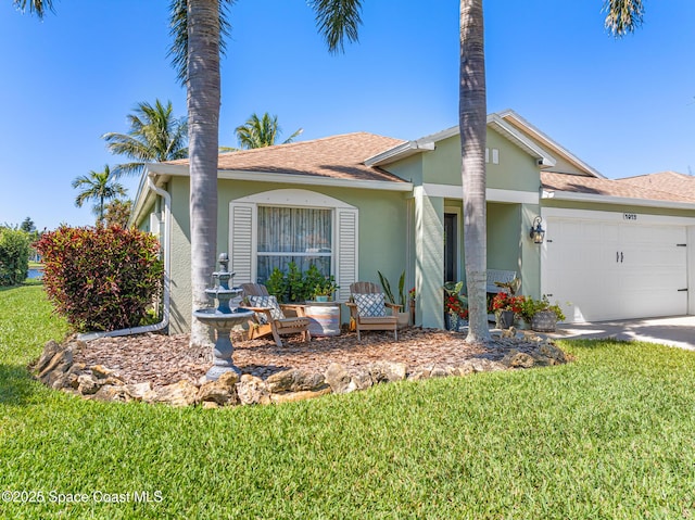 single story home featuring stucco siding, an attached garage, driveway, and a front lawn