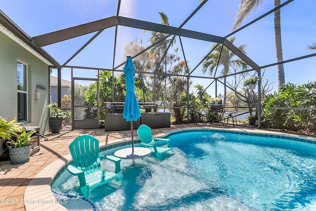 pool with a lanai and a patio area