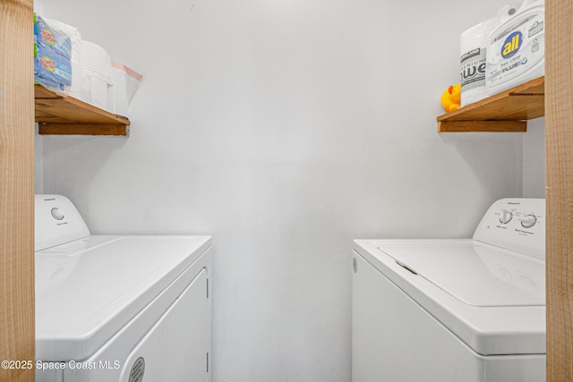 clothes washing area with laundry area and washer and clothes dryer