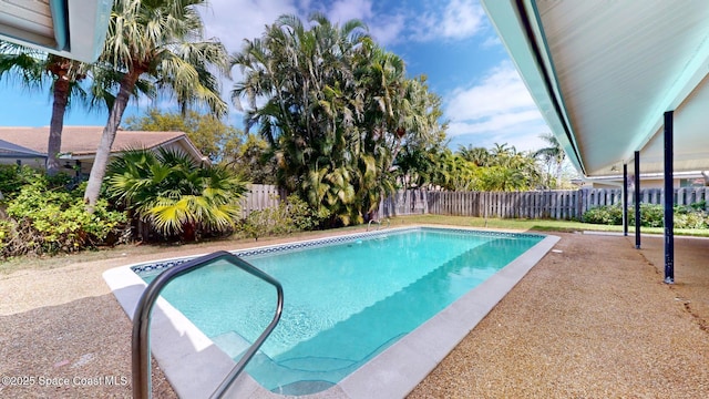 view of swimming pool with a patio area, a fenced backyard, and a fenced in pool