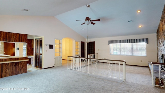 unfurnished room featuring ceiling fan, visible vents, high vaulted ceiling, and light colored carpet