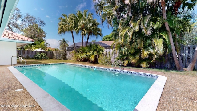 view of pool with a fenced backyard and a fenced in pool