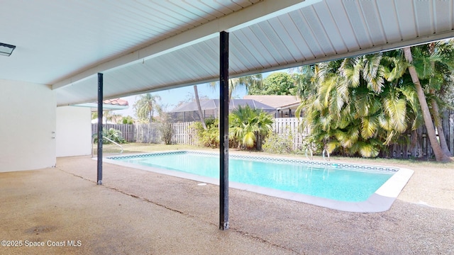 view of swimming pool with a fenced in pool, a patio area, and a fenced backyard