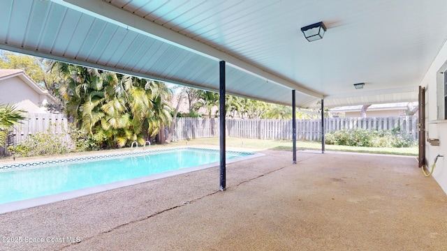 view of swimming pool featuring a fenced in pool, a patio area, and a fenced backyard