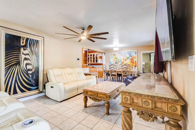 living room with light tile patterned floors and ceiling fan