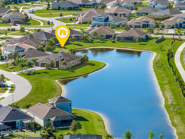 bird's eye view featuring a residential view and a water view