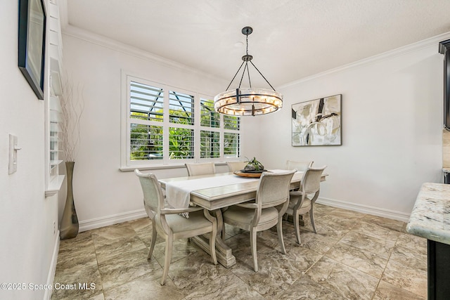 dining space with baseboards, an inviting chandelier, and ornamental molding