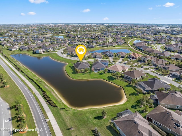 aerial view featuring a residential view and a water view