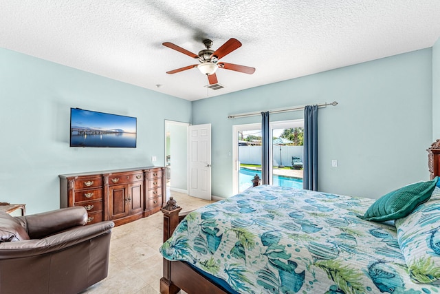 303 Harrison Ave, Cape Canaveral, FL 32920 - bedroom featuring baseboards, visible vents, ceiling fan, a textured ceiling, and access to outside