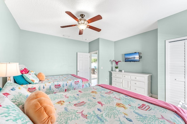 303 Harrison Ave, Cape Canaveral, FL 32920 - bedroom with a ceiling fan, visible vents, and a textured ceiling
