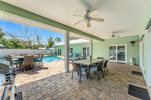 303 Harrison Ave, Cape Canaveral, FL 32920 - view of patio with outdoor dining space, a fenced in pool, a fenced backyard, and ceiling fan