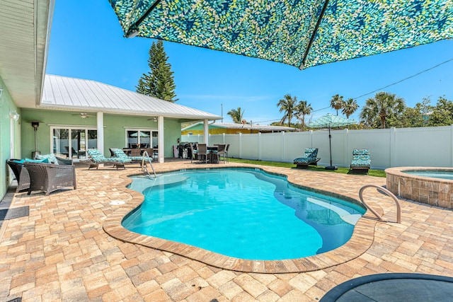 303 Harrison Ave, Cape Canaveral, FL 32920 - view of swimming pool featuring a fenced in pool, an outdoor hangout area, a fenced backyard, an in ground hot tub, and a patio