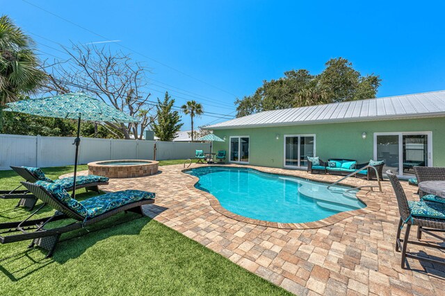 303 Harrison Ave, Cape Canaveral, FL 32920 - view of pool with a fenced in pool, a patio, an in ground hot tub, and a fenced backyard