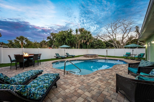 303 Harrison Ave, Cape Canaveral, FL 32920 - view of pool with a fenced in pool, a fire pit, a fenced backyard, and a patio area