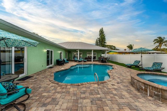303 Harrison Ave, Cape Canaveral, FL 32920 - view of swimming pool with a fenced in pool, a patio, an in ground hot tub, and fence
