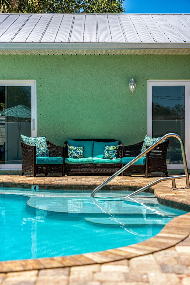 303 Harrison Ave, Cape Canaveral, FL 32920 - view of swimming pool featuring outdoor lounge area