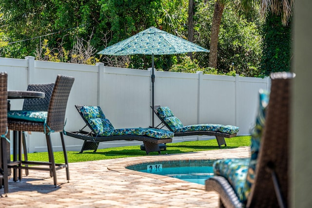 303 Harrison Ave, Cape Canaveral, FL 32920 - view of pool featuring a patio area and fence
