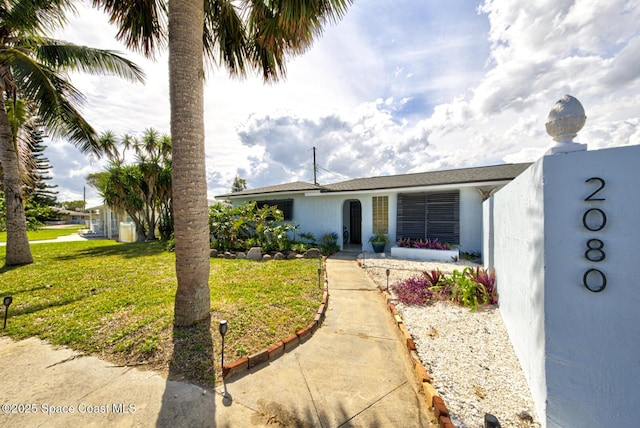 view of front of property with a front lawn