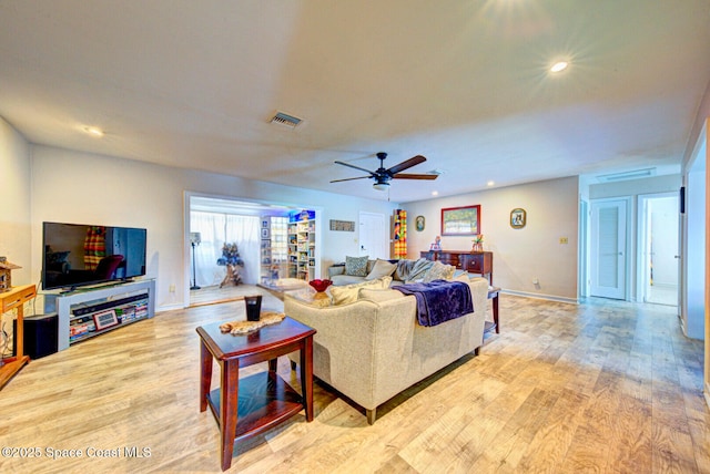 living area with light wood-type flooring, ceiling fan, visible vents, and recessed lighting