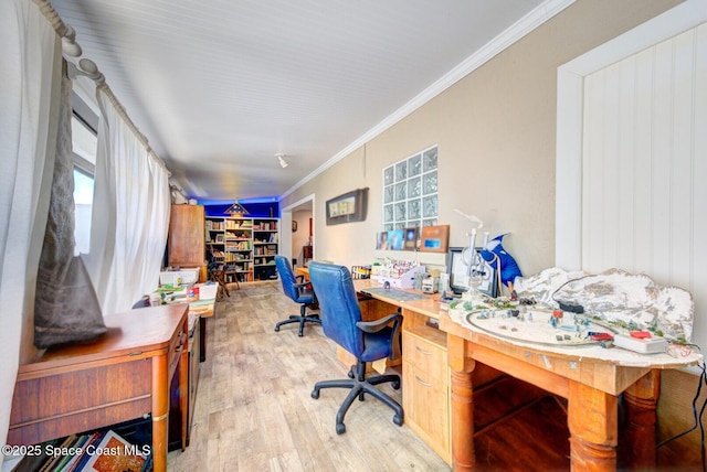 office area with ornamental molding and wood finished floors