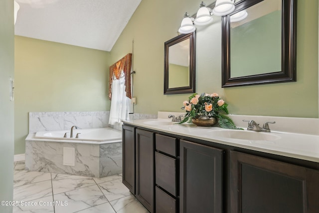 bathroom featuring marble finish floor, a sink, a textured ceiling, and double vanity