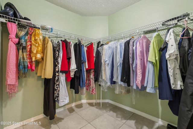 spacious closet featuring tile patterned flooring