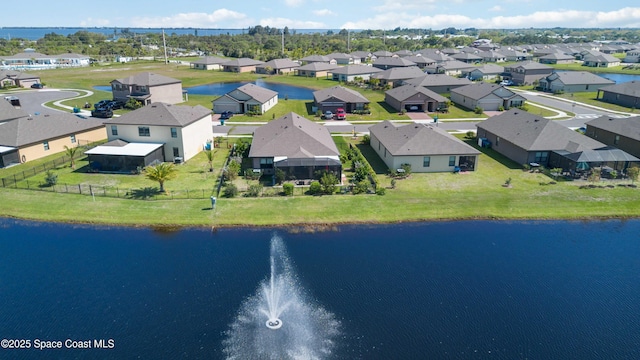 aerial view with a residential view and a water view