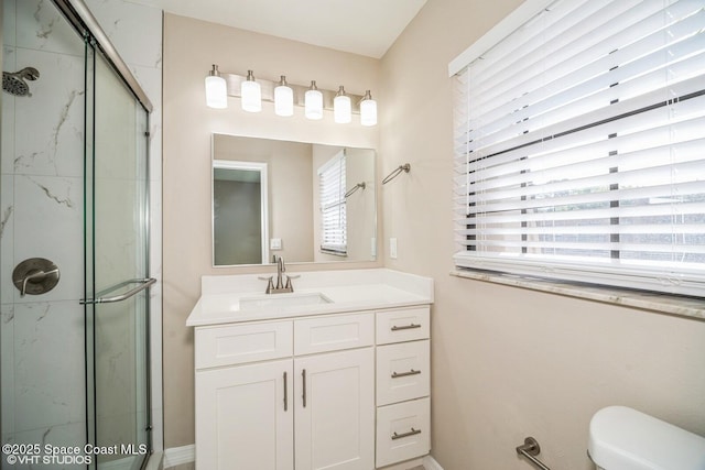 full bathroom with a shower stall, toilet, and vanity