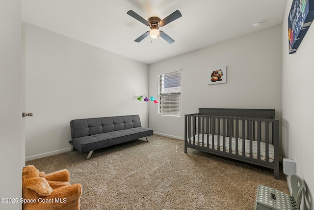 carpeted bedroom featuring a ceiling fan and baseboards