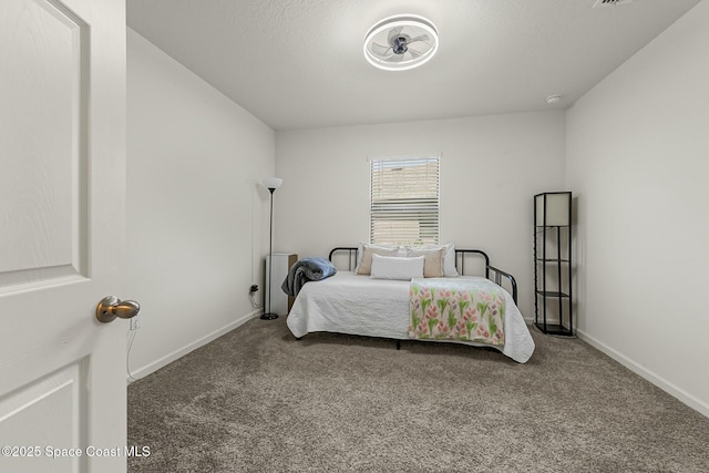 carpeted bedroom featuring baseboards