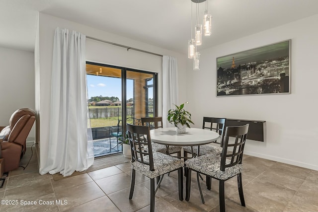 dining area featuring baseboards