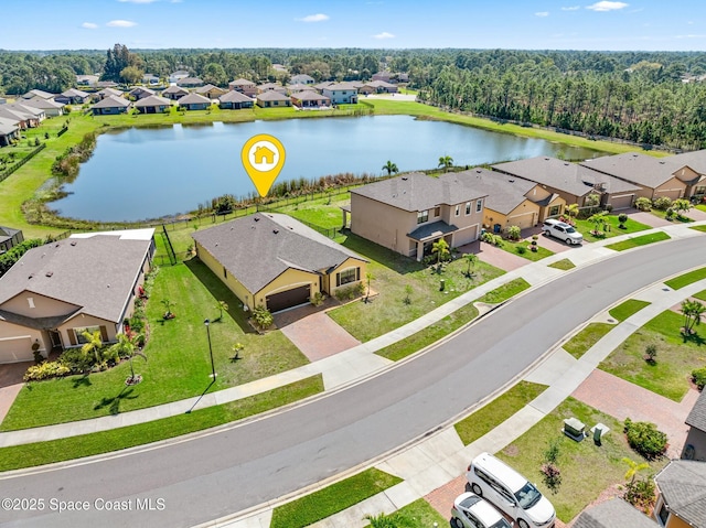 bird's eye view featuring a water view and a residential view