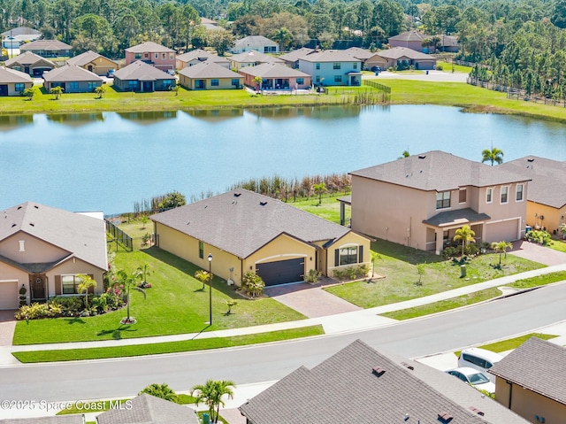 aerial view featuring a residential view and a water view