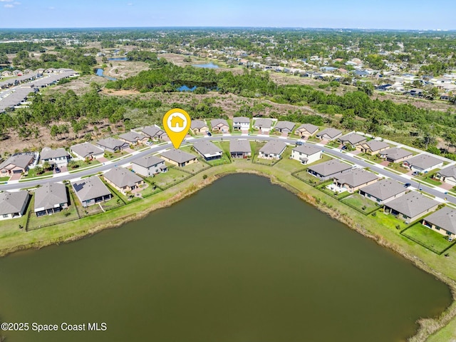 aerial view with a residential view and a water view