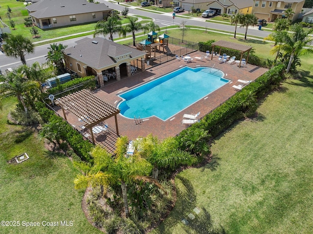 pool with a patio area, fence, a lawn, and a pergola