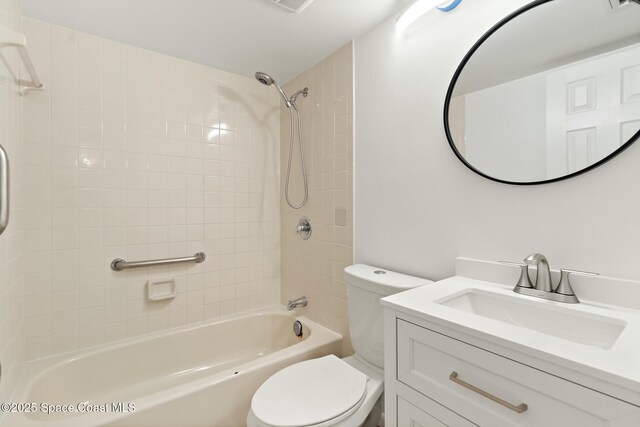 full bathroom featuring shower / bathing tub combination, vanity, and toilet