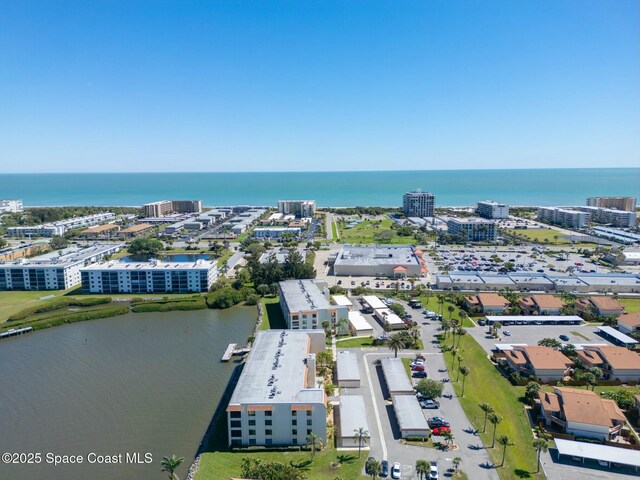 drone / aerial view with a view of city and a water view