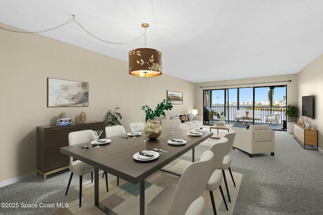 dining room with light carpet and baseboards