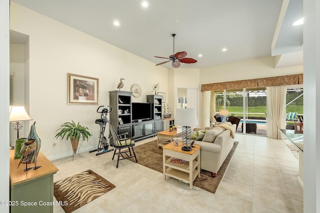 living area with light tile patterned floors, baseboards, ceiling fan, and recessed lighting