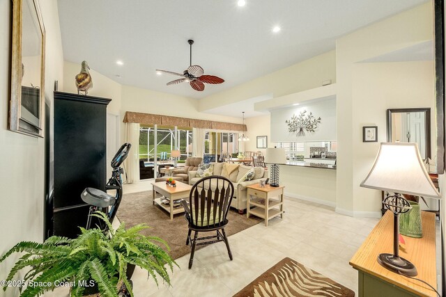 living area with recessed lighting, a ceiling fan, baseboards, and light tile patterned floors