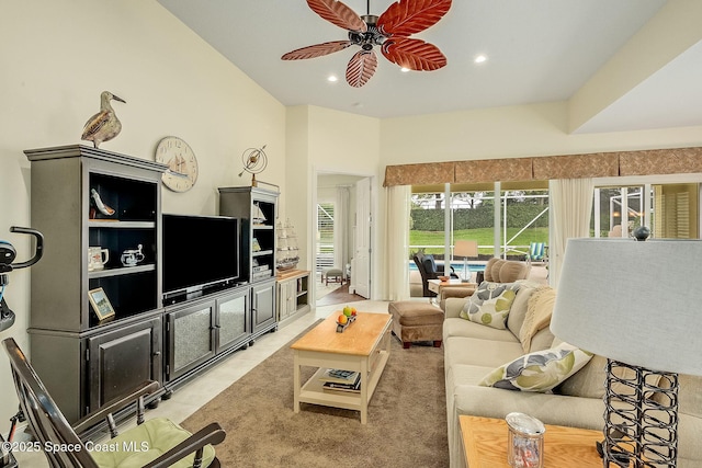 living area with light tile patterned floors, recessed lighting, and a ceiling fan