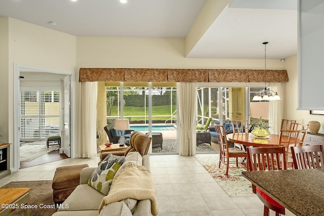 sunroom / solarium with a chandelier and a healthy amount of sunlight