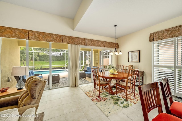 dining area with a notable chandelier and light tile patterned floors