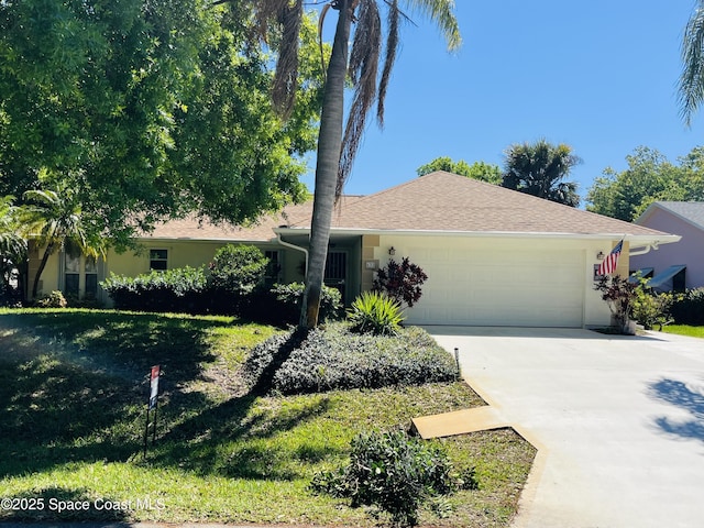 ranch-style house featuring an attached garage, driveway, a front lawn, and stucco siding